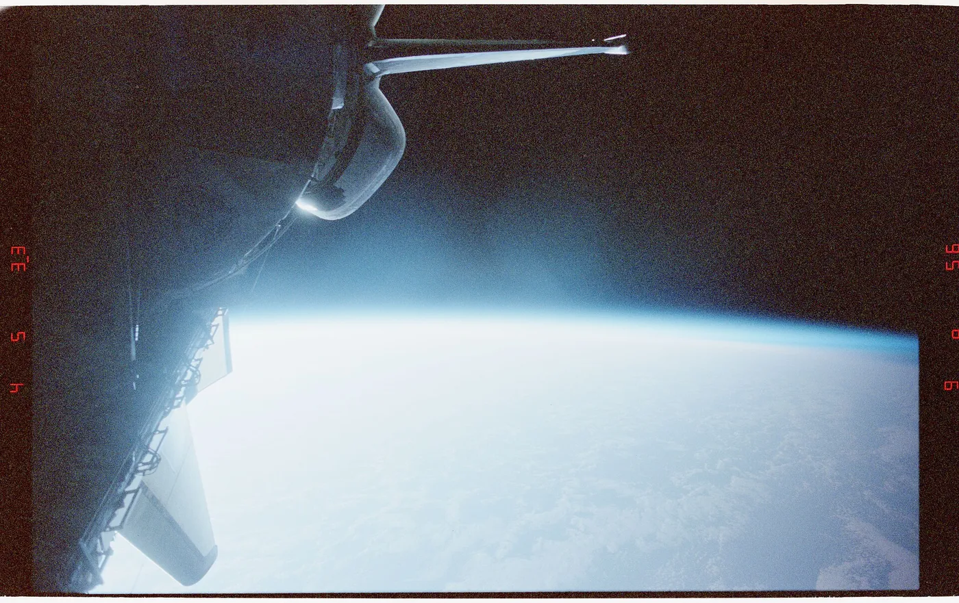 21 034 Open payload bay, SPACELAB, Earth Limb, clouds and blank void of space. DPLA 0bb9286abcfb3744f8e6fe351f28dc07