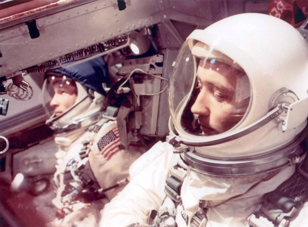 James McDivitt and Ed White side by side in the cramped Gemini cabin.