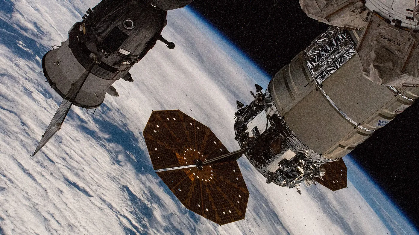 The Cygnus cargo spacecraft and the Soyuz MS 26 crew ship