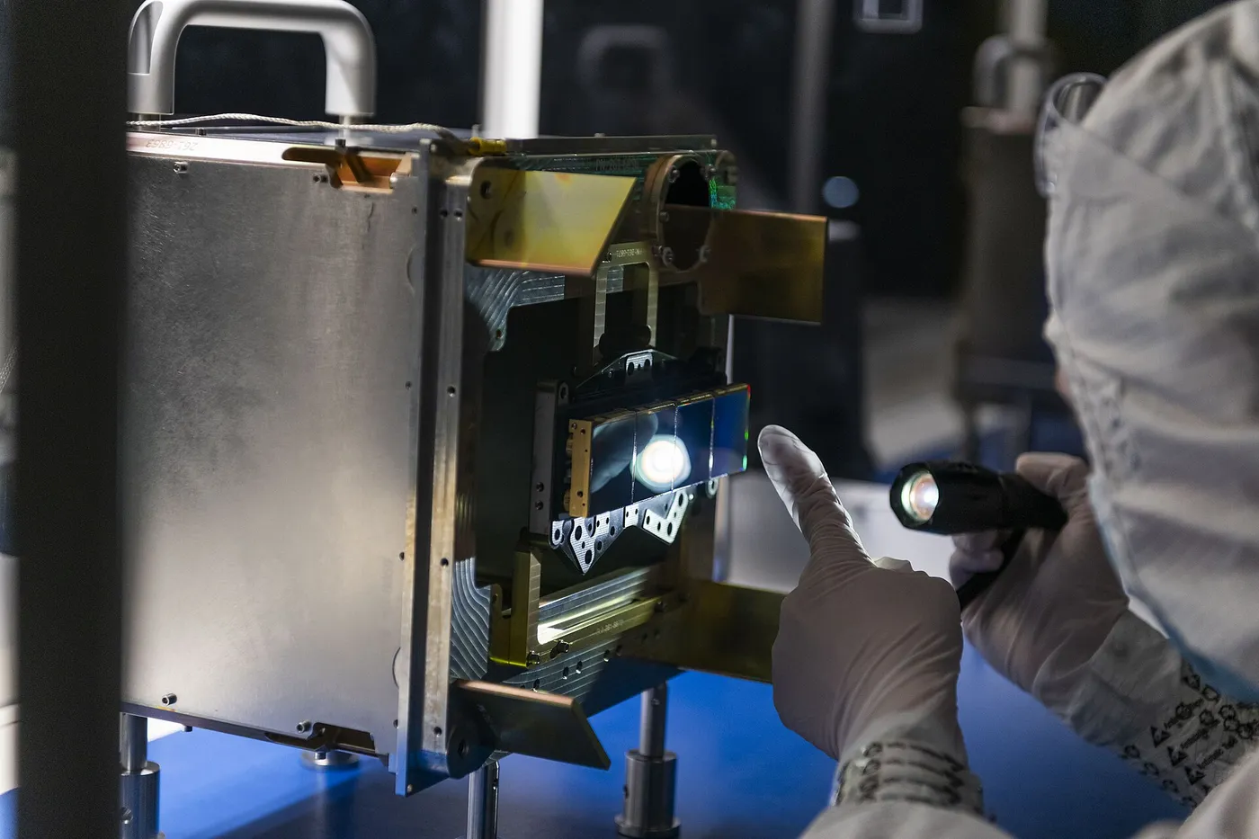 An engineer inspects NEO Surveyor’s Infrared Detectors