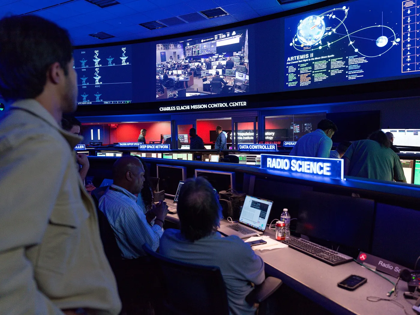 Staff at NASA’s Jet Propulsion Laboratory in Southern California watch the agency’s Artemis II mission unfold soon after launch on April 1, 2026, at