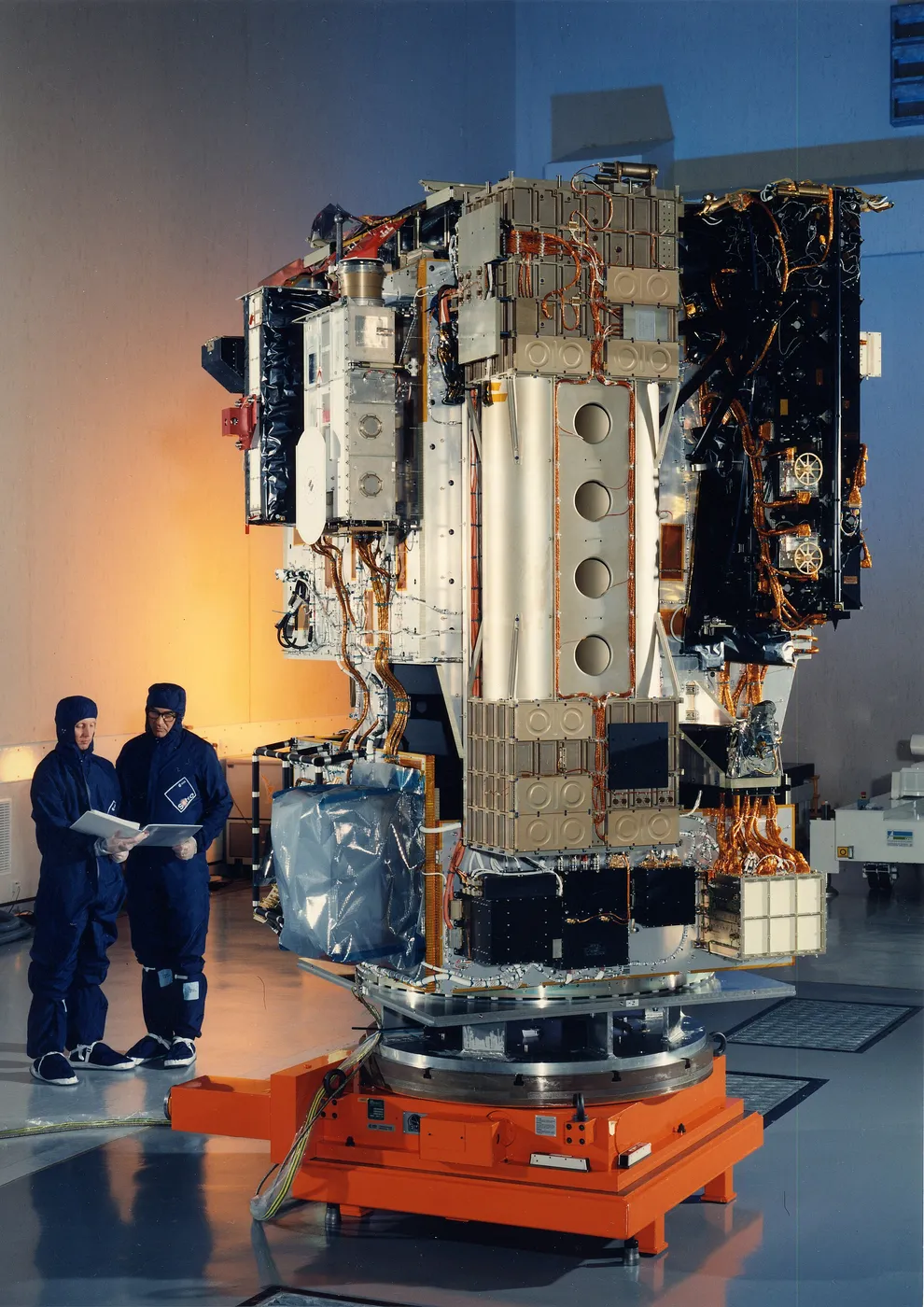 ESA engineers work on the SOHO spacecraft