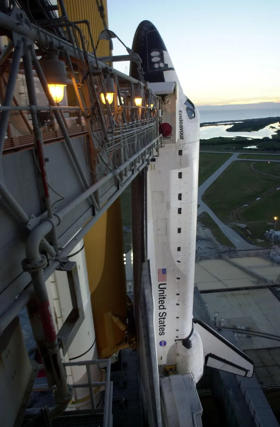 Shuttle Endeavour sitting on the launchpad on a clear morning (NASA photo number KSC-00PADIG-113)