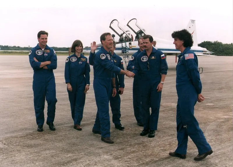 STS 71 crew greet each other after arrival