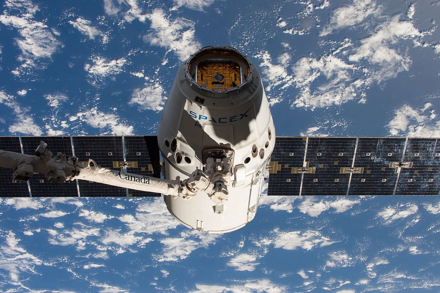 SpaceX CRS-11 Dragon grappled by the ISS Canadarm2.
