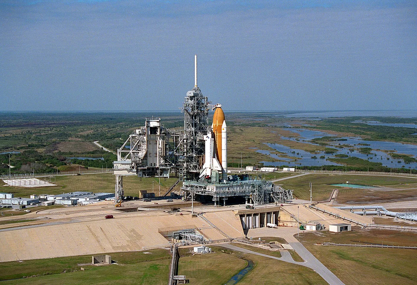 Aerial view showing Space Shuttle Columbia at Launch Pad 39B following rollout from the Vehicle Assembly Building; Columbia is being prepared for…