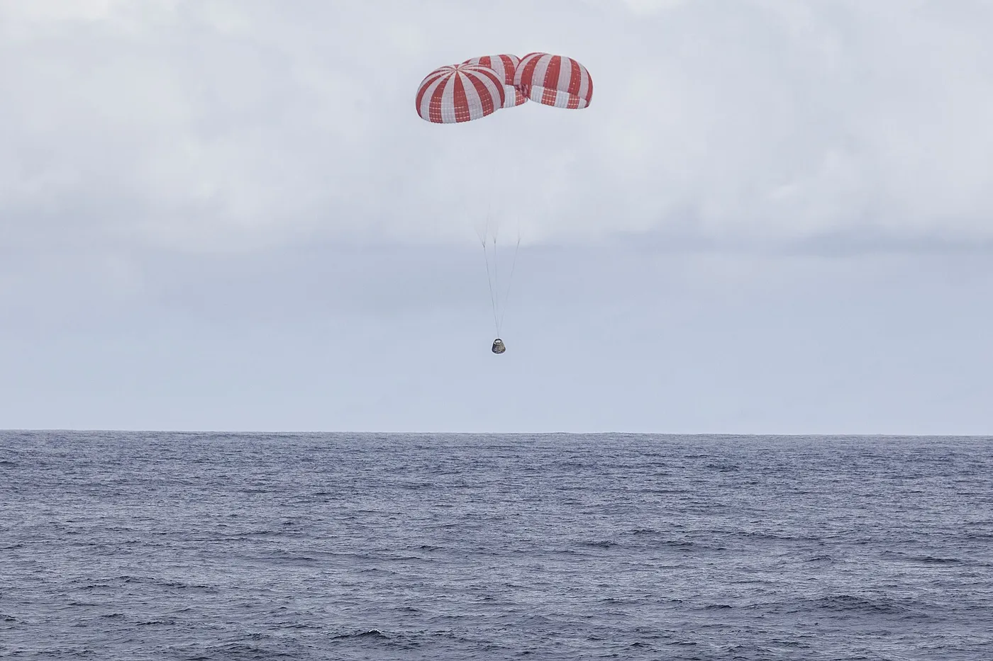 CRS 4 Dragon under parachute