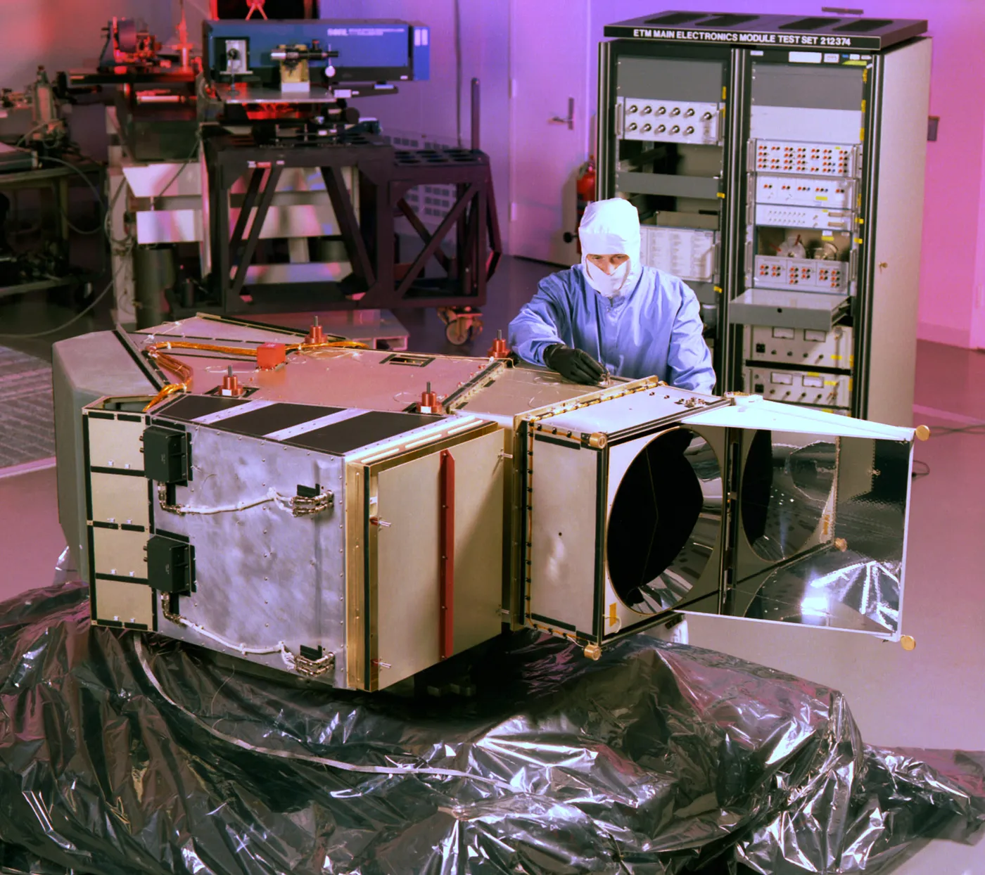 An engineer with the Landsat 7 ETM+ instrument in cleanroom.