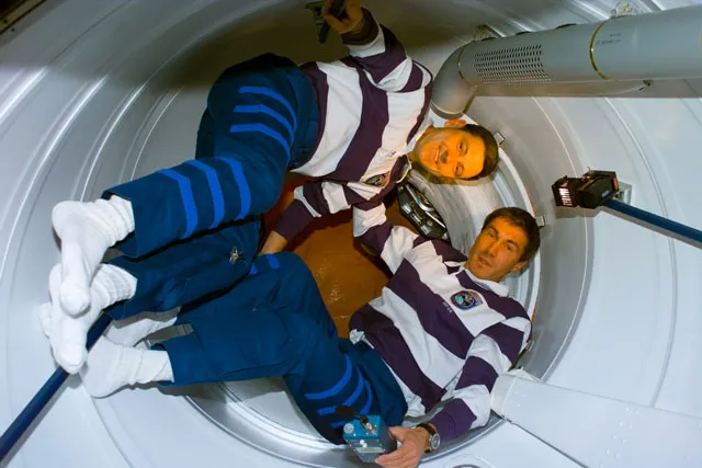 STS-88 astronauts open the hatch to the newly attached Zarya module