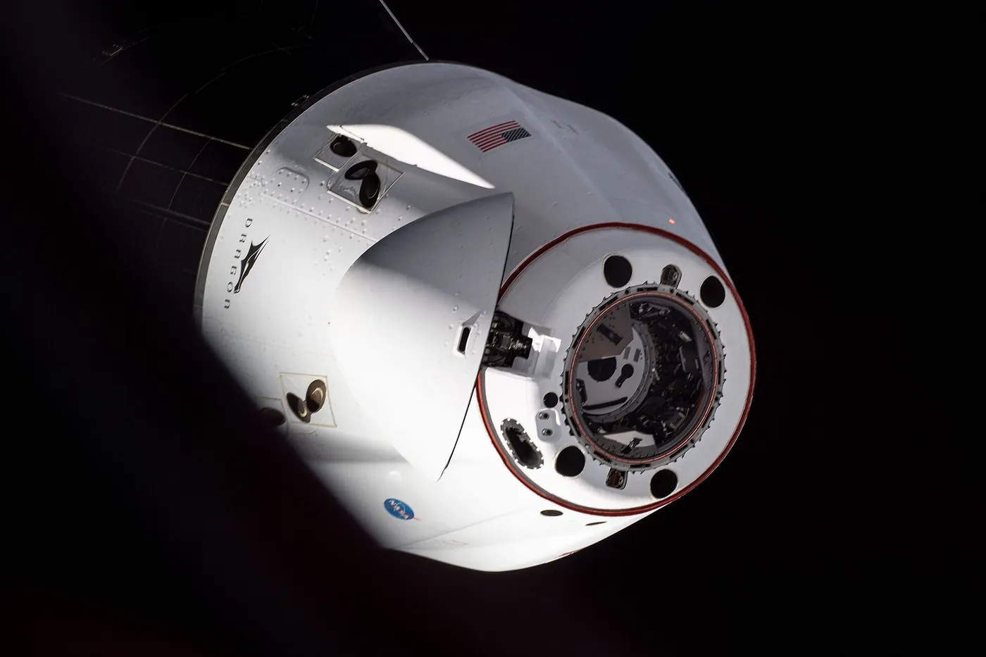 iss065e162289 (July 8, 2021) --- The SpaceX Cargo Dragon resupply ship is photographed departing the International Space Station after it undocked…