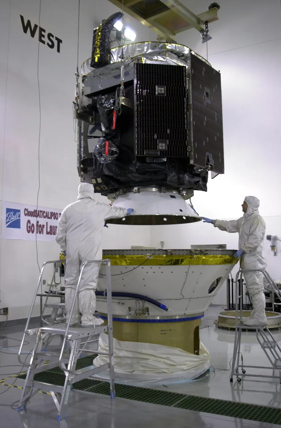 CloudSat is lowered into the lower part of the dual-payload attach fitting.
