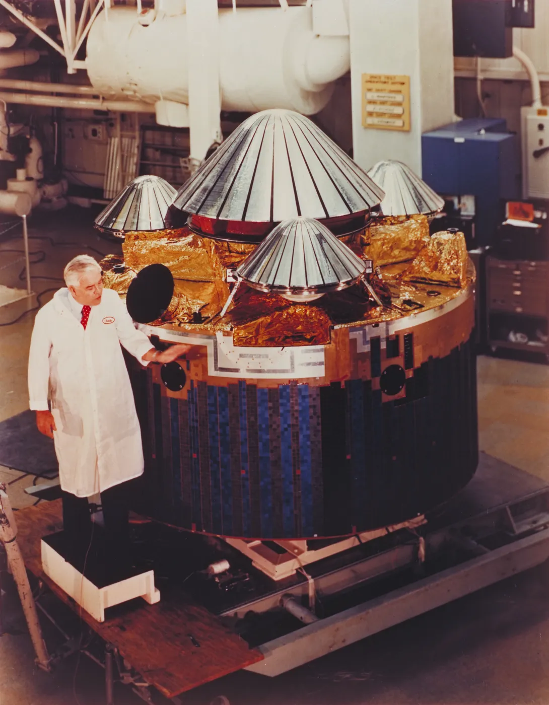 Charlie Hall inspects the Pioneer Venus multiprobe at Hughes Aircraft Co. in Dec. 1976
