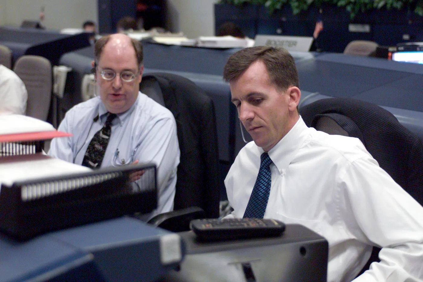 Flight Directors Wayne Hale (left) and LeRoy Cain in the shuttle flight control room (WFCR) in Houston's Mission Control Center (MCC) in support of…