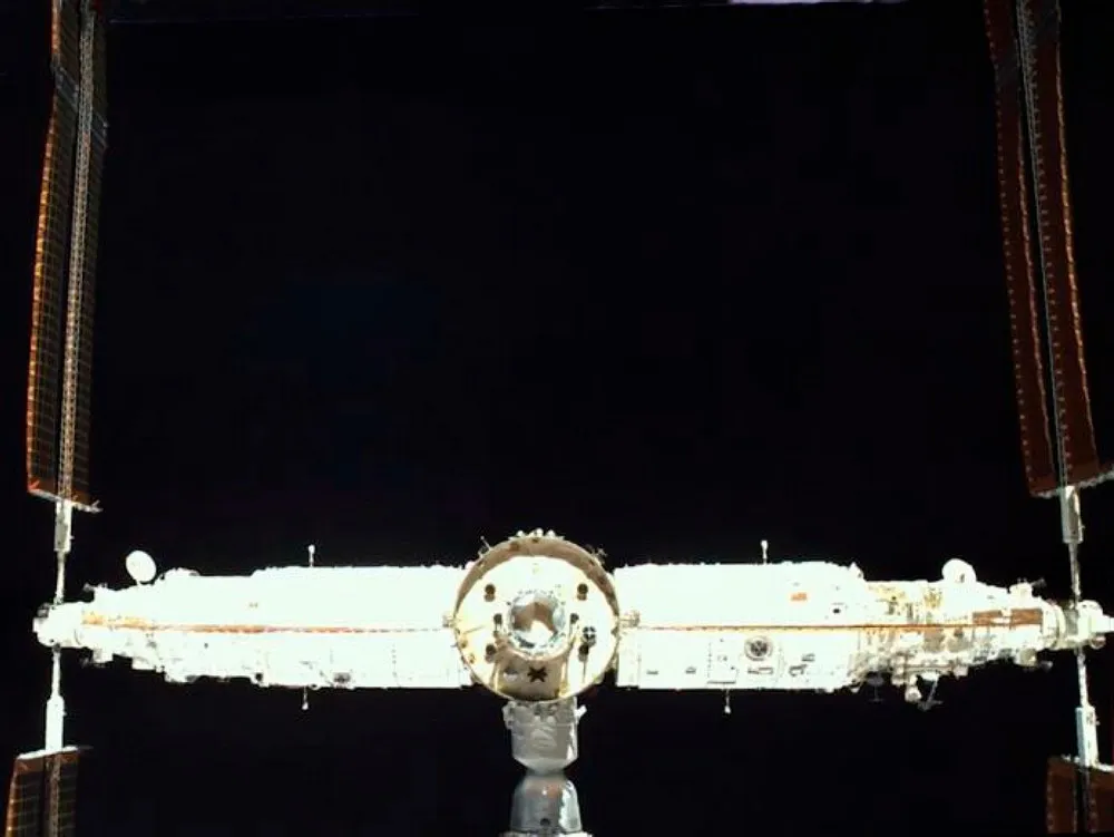 Rear view of Tiangong Space Station. From left to right were Mengtian lab module, Tianhe core module, Wentian lab module, with Shenzhou spacecraft…