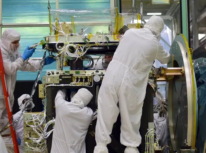 NASA engineers conduct a fit test on the ATLAS instrument of the ICESat-2 mission
