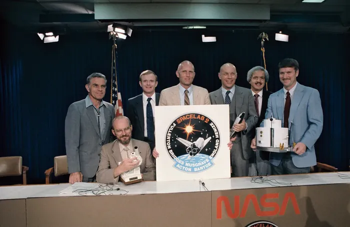 STS 51 F crew at preflight conference
