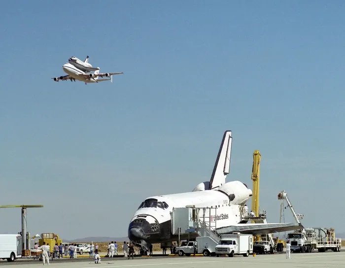 Endeavour on Runway with Columbia on SCA Overhead 000160