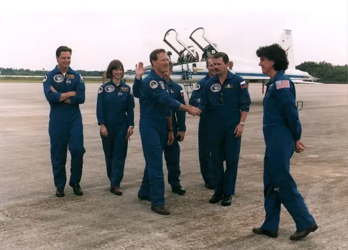 STS 71 crew greet each other after arrival