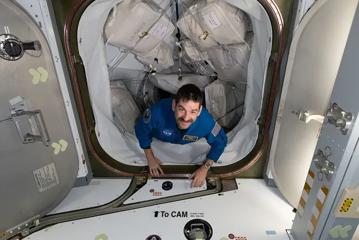 NASA astronaut Jack Hathaway enters the International Space Station