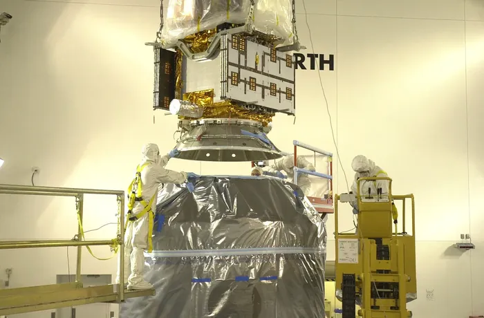 CALYPSO is lowered to the dual-payload attach fitting with CloudSat in it.