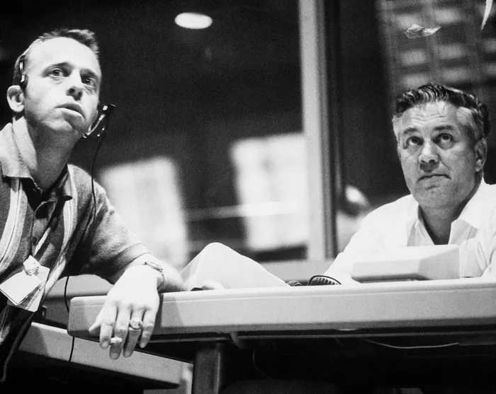 S63-07857 (15-16 May 1963) --- Astronaut Alan Shepard (left) and Walter C. Williams monitor progress of the Mercury Atlas 9 (MA-9) mission from…