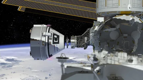 This artist's concept shows Boeing’s CST-100 Starliner spacecraft, currently under development for NASA’s Commercial Crew Program, docking to the Inte