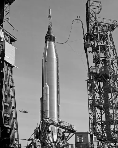 Cape Canaveral, Fla. -- Low angle view of Atlas and Friendship 7 spacecraft between gantry equipment during prelaunch preparations.
