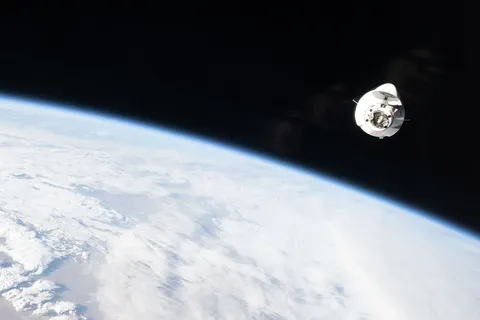A SpaceX Dragon cargo spacecraft approaches the International Space Station