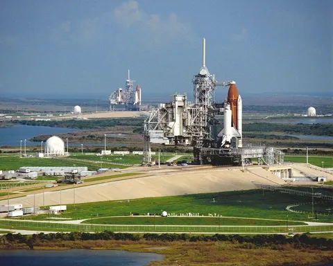 Space Shuttle Columbia rests on Pad 39A during the troubled summer of 1990. Discovery is in the background on Pad B awaiting launch on STS-41.