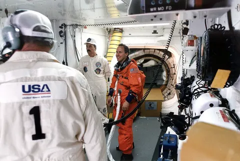 KSC 96EC 1295 NASA Mission Specialist Thomas Jones in White Room prior to launch of Space Shuttle mission STS 80