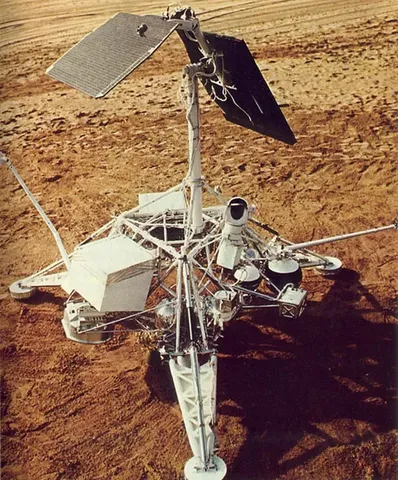Full-scale mockup of the Surveyor spacecraft, displayed on a terrestrial beach.