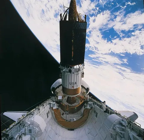 The sixth Tracking and Data Relay Satellite (TDRS-F) is relased from the payload bay of Endeavour atop the Boeing Inertial Upper Stage (IUS) early in 