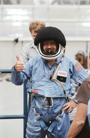 Payload Specialist Scully Power in full flight suit with helmet