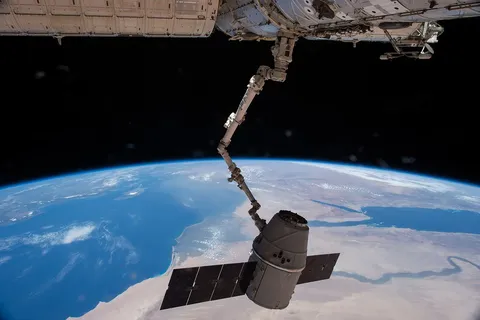 ISS 43 Canadarm2 grapples CRS 6 Dragon over northern Africa