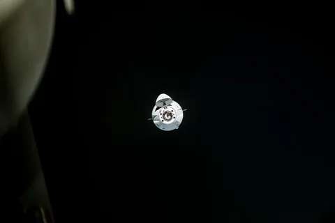 iss068e025336 (Nov. 27, 2022) --- The SpaceX Dragon cargo craft, loaded with over 7,700 pounds of science, supplies, and cargo, approaches the…