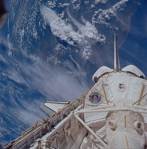 Space Shuttle Columbia with the Spacelab module attached, over the Southern coast of Sri Lanka