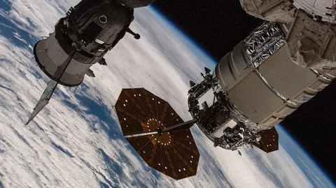 The Cygnus cargo spacecraft and the Soyuz MS 26 crew ship