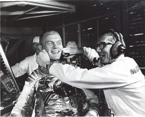 Guenter Wendt, the original pad leader for NASA's manned space program, coaxes a smile out of astronaut John Glenn after the MA-6 mission was…