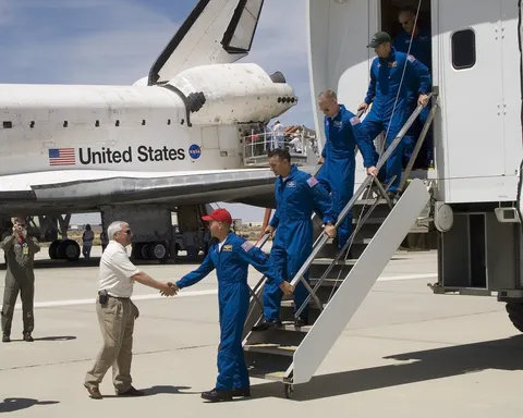 DFRC Center Director Kevin Petersen greets Commander Frederick Sturckow and the crew of the Space Shuttle Atlantis at Edwards, AFB, Calif , on June…
