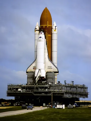 Space shuttle Challenger being moved to the launch pad on the crawler in September 1985 preparing for STS-61-A, its next-to-last flight. Scanned from…