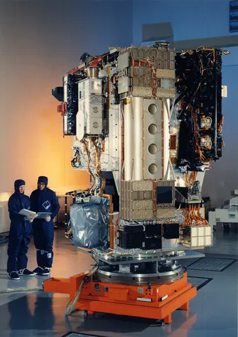 ESA engineers work on the SOHO spacecraft