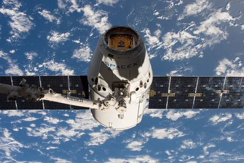 SpaceX CRS-11 Dragon grappled by the ISS Canadarm2.