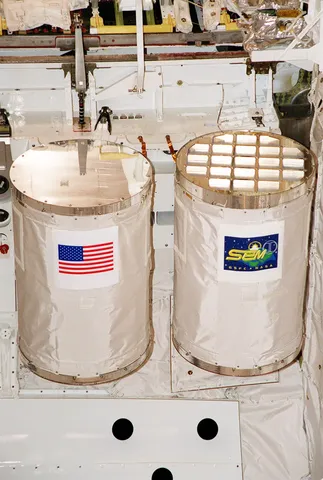 Getaway Special canisters in Atlantis' payload bay for