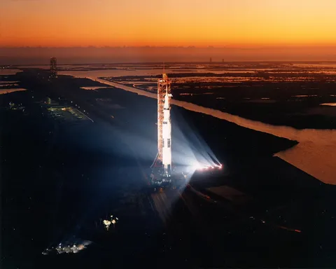 Saturn V bathed in floodlight before rollout