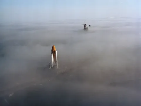 Space Shuttle *Challenger*'s rollout through the fog moments before its first mission to space.