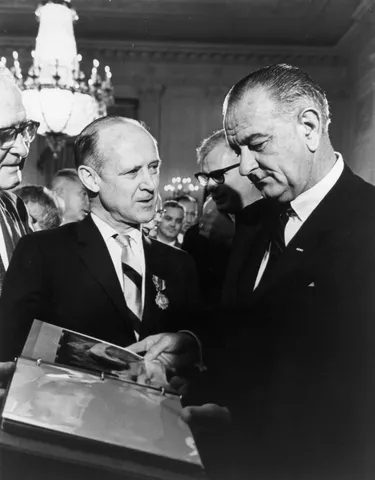 Dr. William H. Pickering, (left) Director of the Jet Propulsion Laboratory presents Mariner spacecraft photos to President Lyndon Baines Johnson.