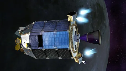 An artist's concept of NASA's Lunar Atmosphere and Dust Environment Explorer (LADEE) spacecraft firing its maneuvering thrusters in order to maintain…