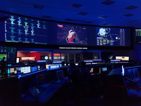 The Artemis II mission patch appears in the center screen of the Space Flight Operations Facility at NASA’s Jet Propulsion Laboratory in Southern…